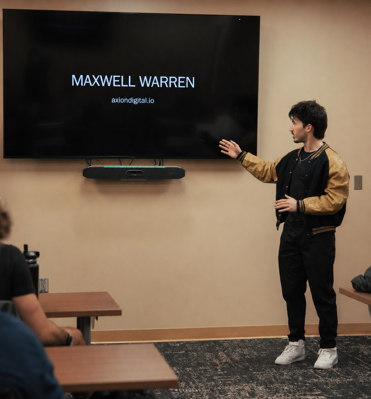 Maxwell presenting at a speaking event